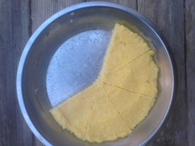Polenta is a great side and I use it often instead of potatoes or just for a little variety. This polenta was put hot in the tin and I fried up the wedges